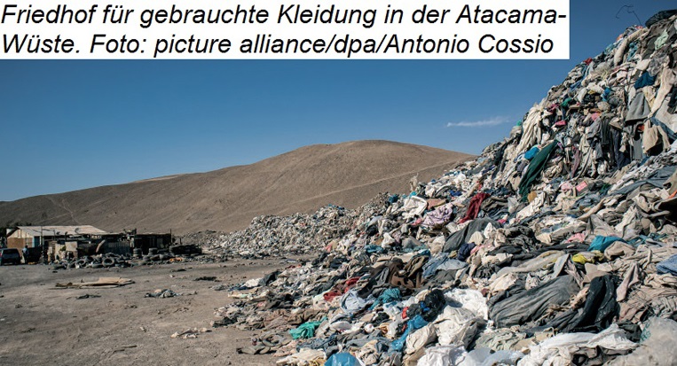 Happy female farmer holding a box with fresh produce